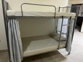 Bed in Dormitory for Men
